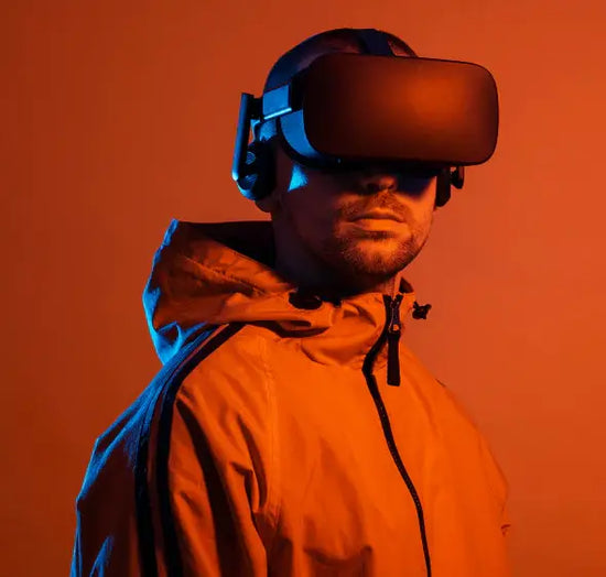 Person wearing a VR headset against an orange background