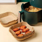 50pcs/set air fryer disposable paper liners in an air fryer with crispy chicken and fries.